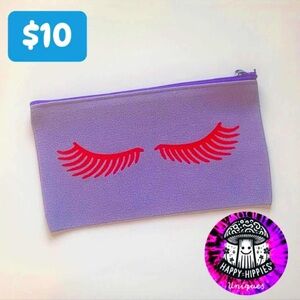 Purple Pouch with Red Eyelash Design